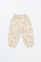 Avauma Breeze Jogger Pants in yellow flower pattern, flat lay of lightweight cotton pants with floral print.